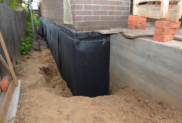 Happy homeowners after waterproofing job in Fraser